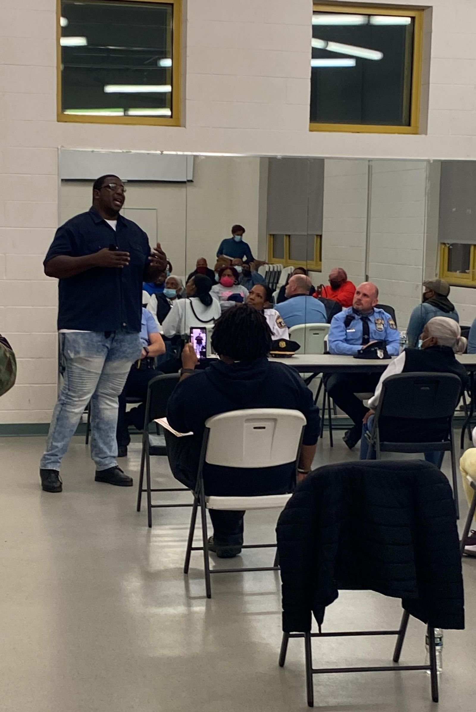 Keenan Hudson addressing a community meeting